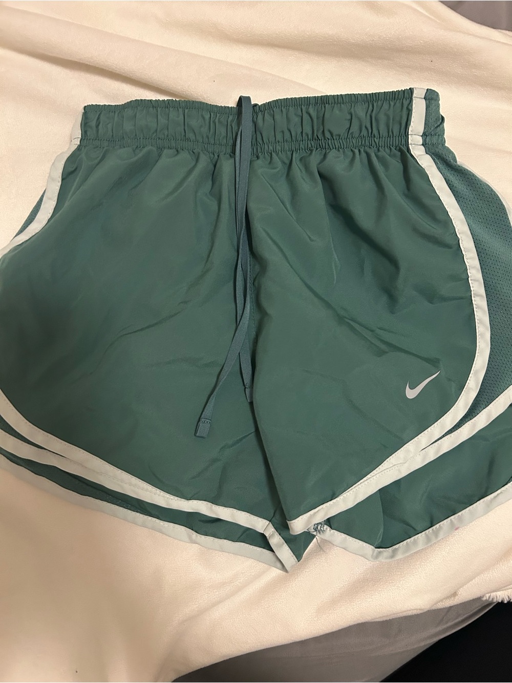 Green Nike running shorts